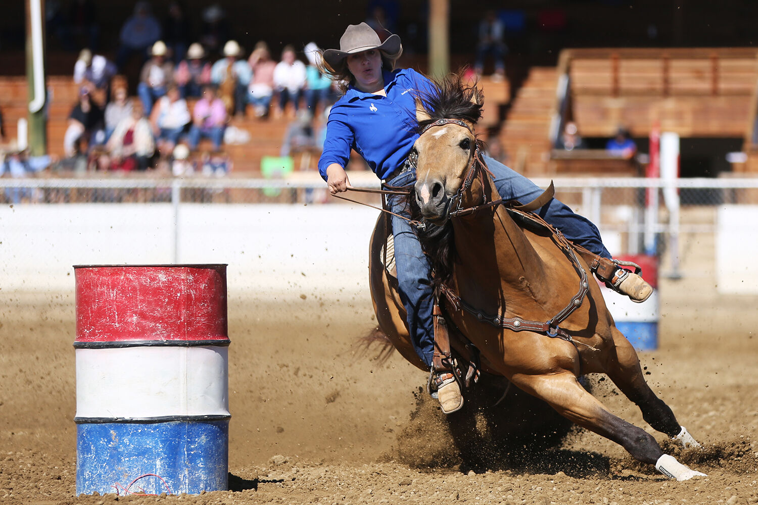 Isabelle Camino pulls around the first barrel during her barrel race